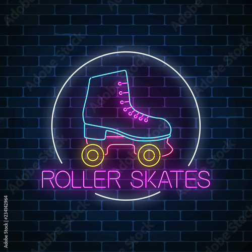 Retro roller skates glowing neon sign in circle frame on dark brick wall background. Skate zone symbol in neon style.