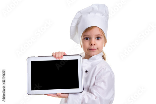Girl chef white uniform isolated on white background. Showing the empty black ipad screen, looking at the camera. Landscape image
