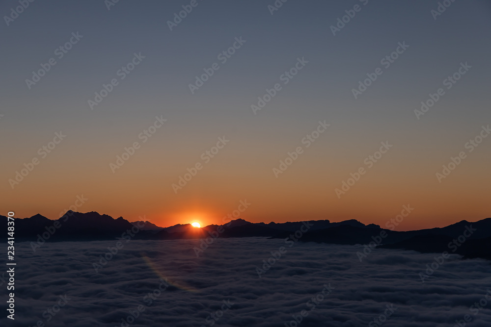 sunset over sea of clouds