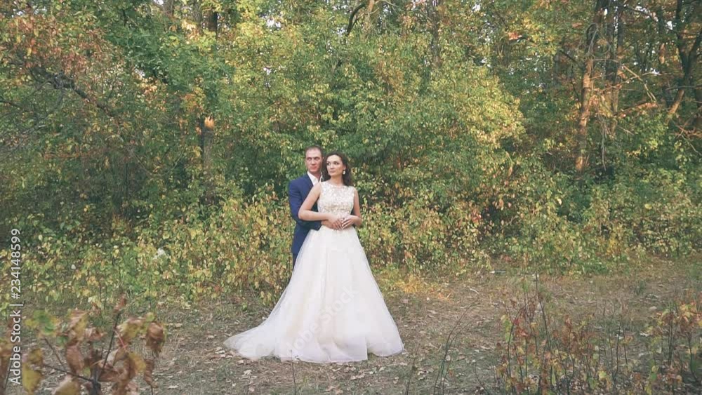 young couple in love on nature in the garden in summer, bride in wedding dress young couple in love on nature in the garden in summer, bride in wedding dress