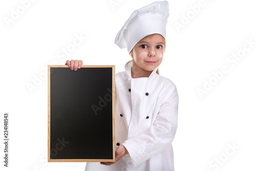 Cute girl chef white uniform isolated on white background. Girl with a floured face holding a menu black empty board. Landscape image