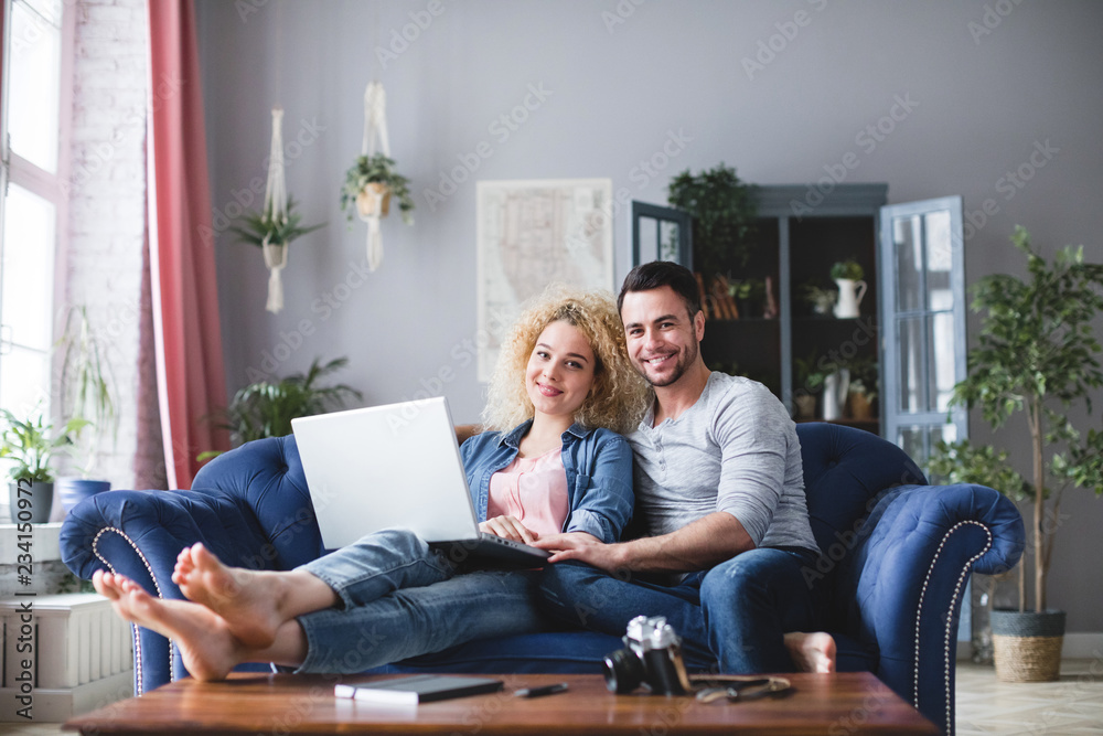 Happy family with laptop at home. Happy family with laptop at home.
