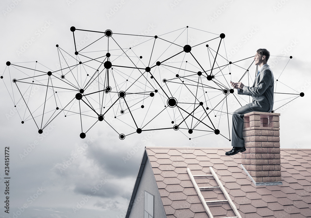 Man on roof with smartphone and concept of social connection Man on roof with smartphone and concept of social connection