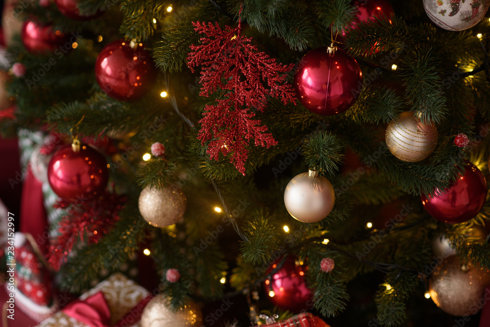 Fototapeta premium Christmas interior with gift boxes and Christmas fires. It can be used as a background