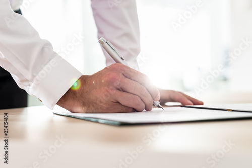 Photography Businessman signing contract or application form