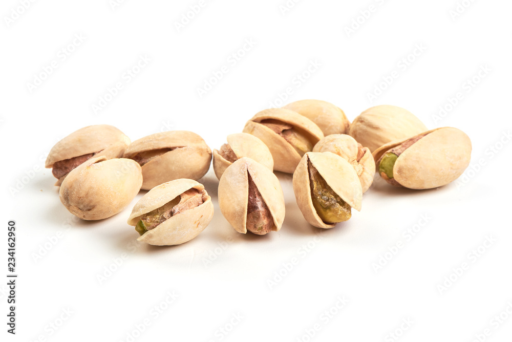 Pistachio nuts, isolated on a white background. Close-up.