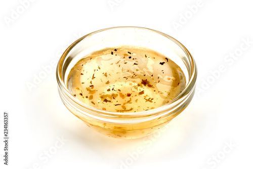 Salad dressing or Homemade sauce, isolated on a white background. Close-up.