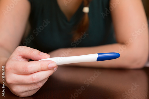 Woman Awaiting Results of Home Pregnancy Test