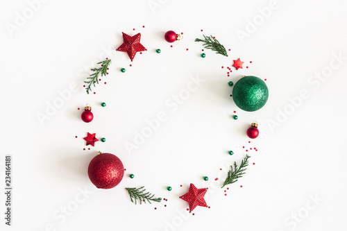 Christmas composition. Christmas wreath made of decorations, fir tree branches on white background. Flat lay, top view, copy space