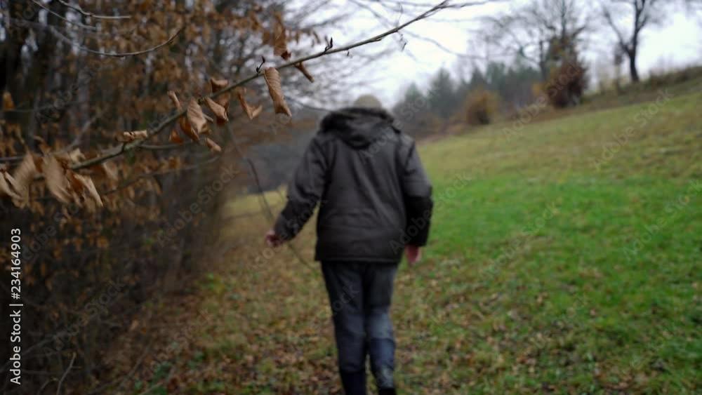 Man walks next to autumn forest - (4K) Man walks next to autumn forest - (4K)