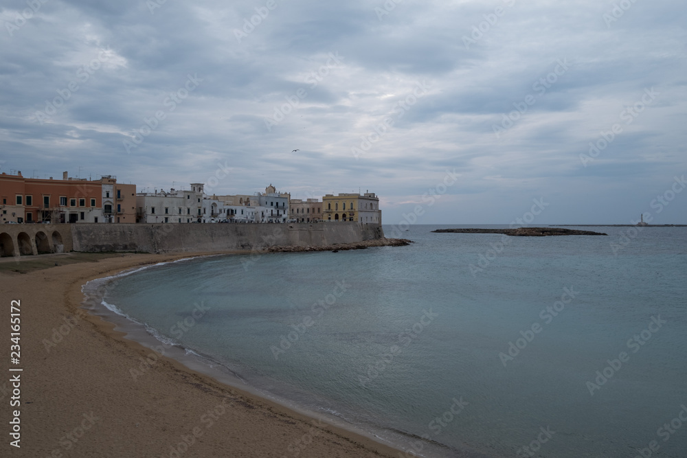 Gallipoli Italy. Wide angle photograph of the beach and coastline in the town of Gallipoli in the Salento Peninsula, Puglia, Southern Italy. 