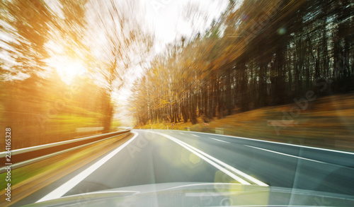 Front view of the highway road passing the country side inside the fast car long exposure shoot