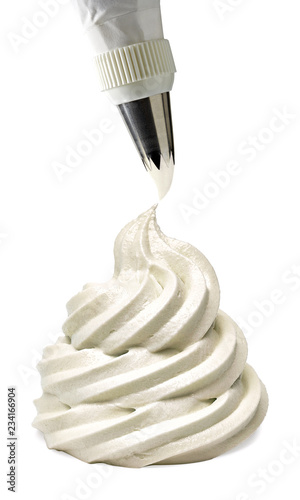 Billede på lærred Whipped and swirl formed vanilla cream with icing bag isolated on white backgrou