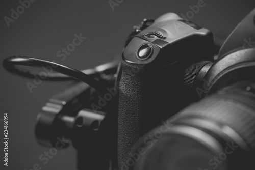 Control buttons mirror less digital camera close-up on a black background  