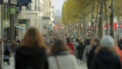 Crowded street Champs-Elysée in Paris. Tourists.  