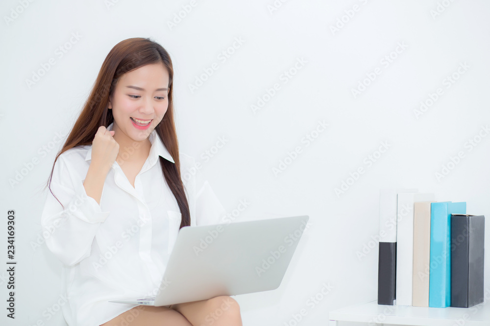 Beautiful of portrait happy young asian woman using laptop work with success on chair in the home, girl and notebook shopping online with glad, communication concept. Beautiful of portrait happy young asian woman using laptop work with success on chair in the home, girl and notebook shopping online with glad, communication concept.