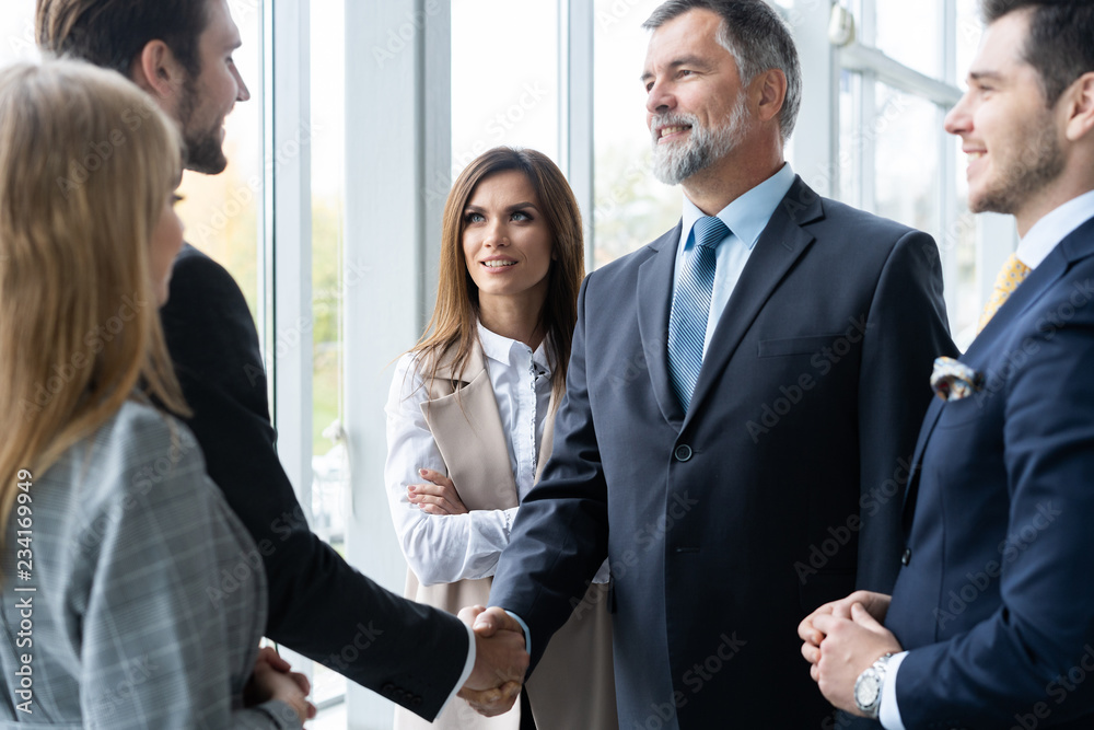 Business people shaking hands, finishing up a meeting. Handshake. Business concept. Business people shaking hands, finishing up a meeting. Handshake. Business concept.