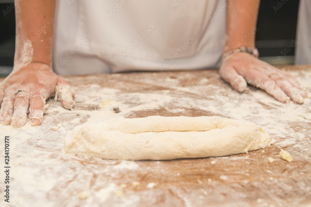 Young children make dough products. Hands closeup