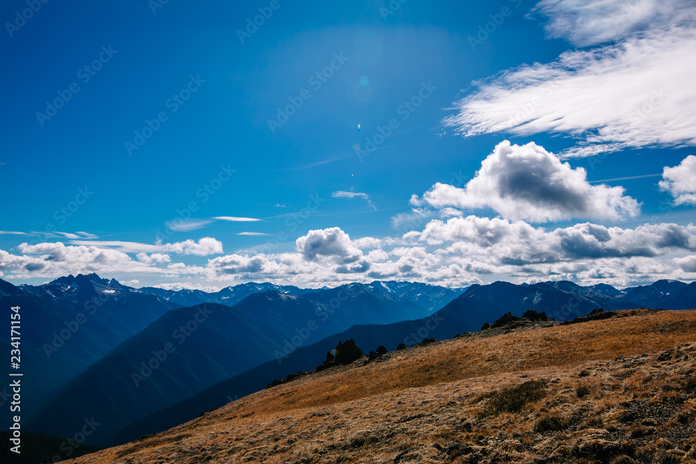 A panoramic view of a remote mountain range on a summer day from a high peak in western Washington state USA