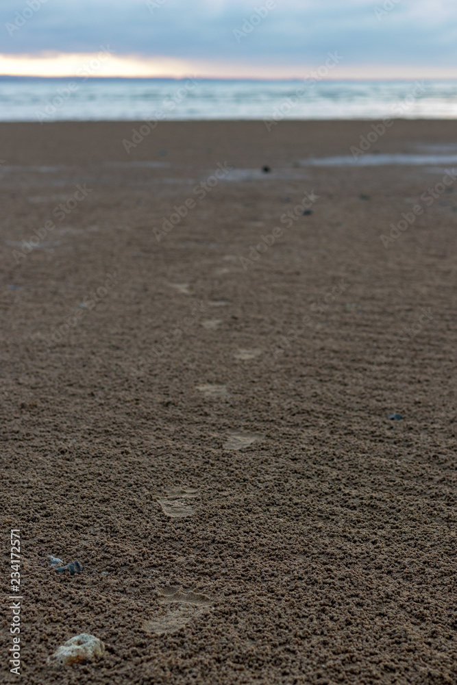 Foot prints on sandy beach Foot prints on sandy beach