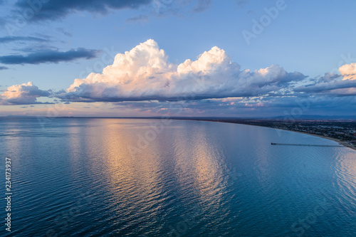 Beautiful clouds reflecting in Port Phillip Bay coastline at sunset