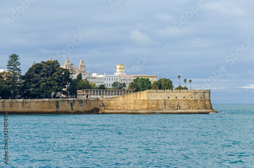 Fototapeta City walls with the bastion Baluarte de la Candelaria and the park of Alameda Ap