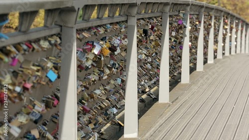 Padlocks of love on a bridge in Paris. Establishing shot