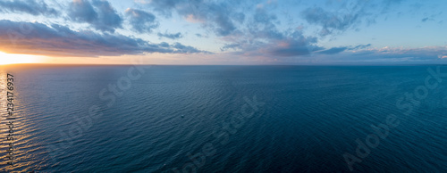 Aerial panorama of sunset over ocean - minimalist seascape © Greg Brave