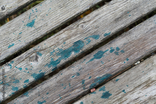 Wooden planks with traces of paint on an old farm