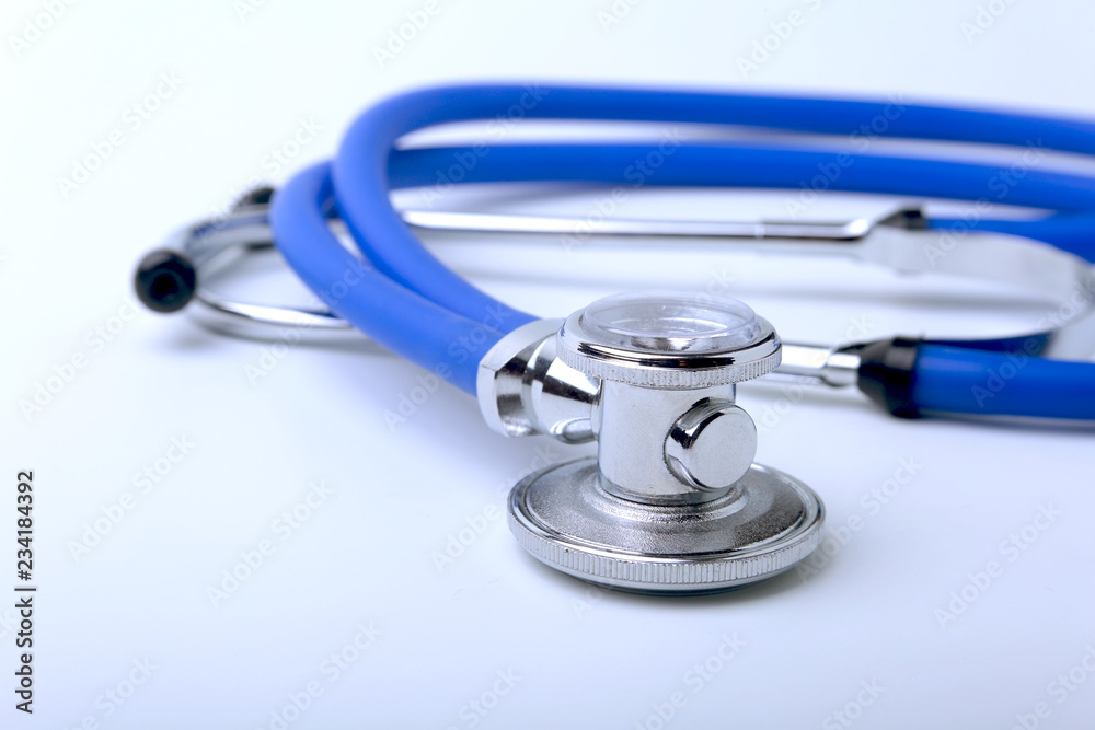 Medical stethoscope isolated on white. Closeup. Selective focus. Medical stethoscope isolated on white. Closeup. Selective focus.