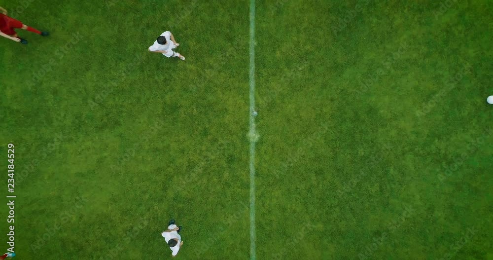 Aerial Top Down View of Soccer Field and Two Professional Teams Playing. Kick off Start of the Energetic Match on International Championship
