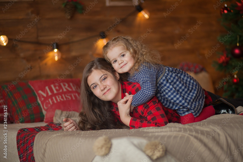 beautiful sisters on christmas decorated room
