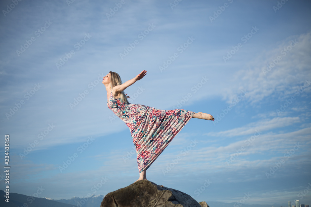 Attractive woman practicing yoge pose copy space