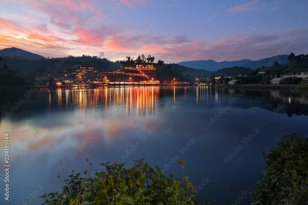 Obraz premium Beautiful scenery during twilight of Yunnan Chinese Village is located on the hill at Ban Rak Thai , Mae Hong Son in Thailand.This is very popular for photographers and tourists.