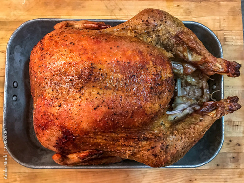 Delicious whole cooked turkey with brown crispy skin holiday dinner