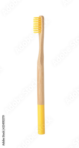 Bamboo toothbrush on white background. Dental care