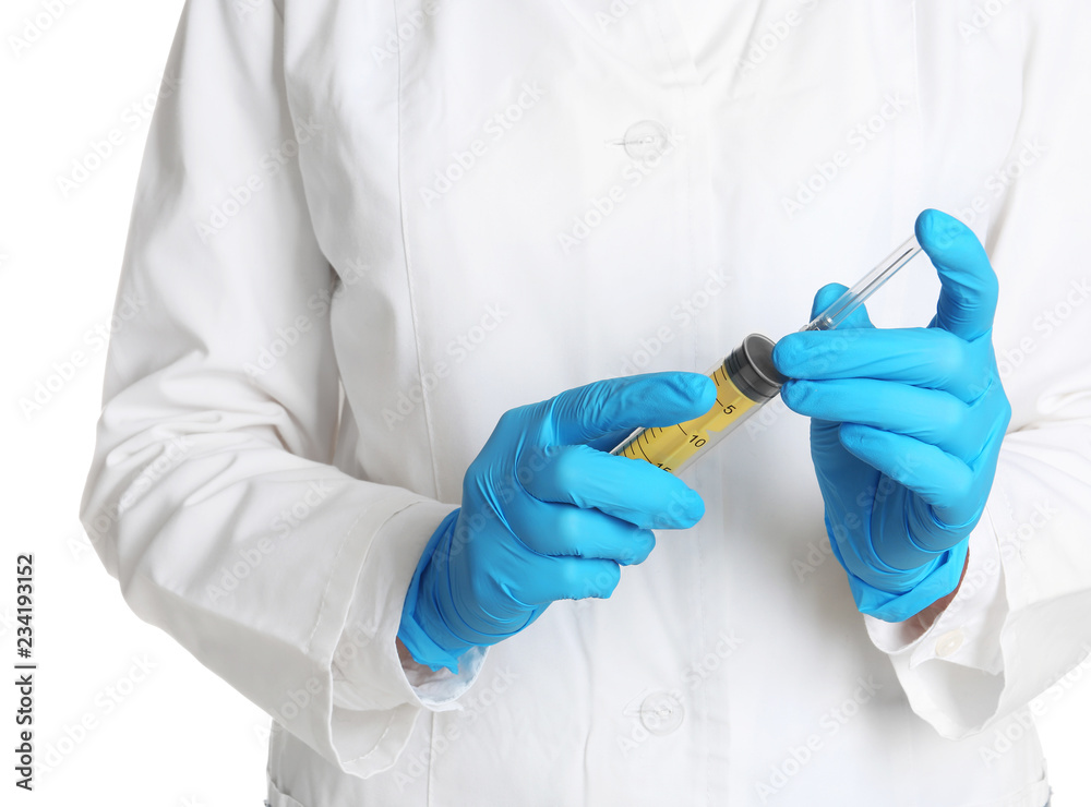 Doctor in medical gloves holding empty syringe on white background Doctor in medical gloves holding empty syringe on white background