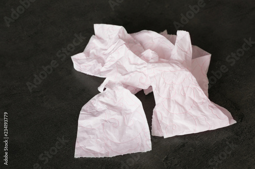 Crumpled soft toilet paper on black background