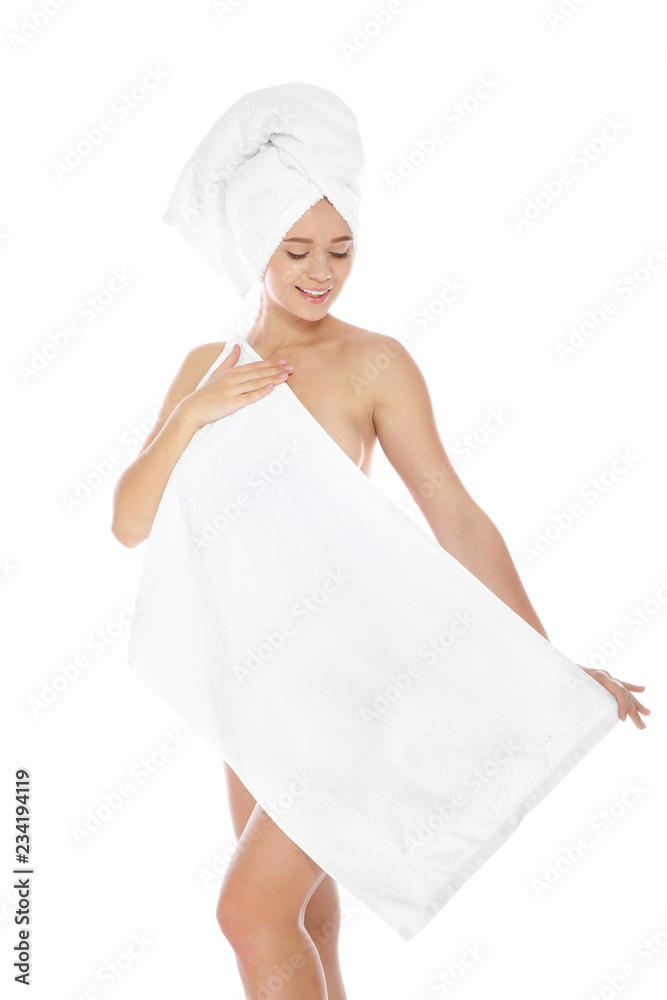 Portrait of young pretty woman with towels on white background Portrait of young pretty woman with towels on white background