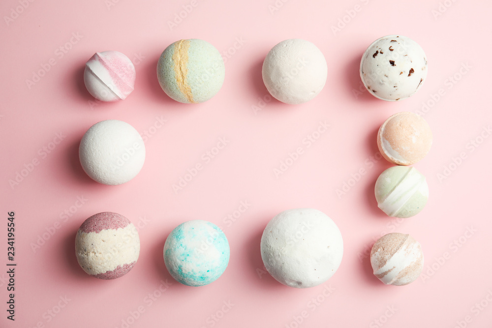 Flat lay composition with bath bombs and space for text on color background