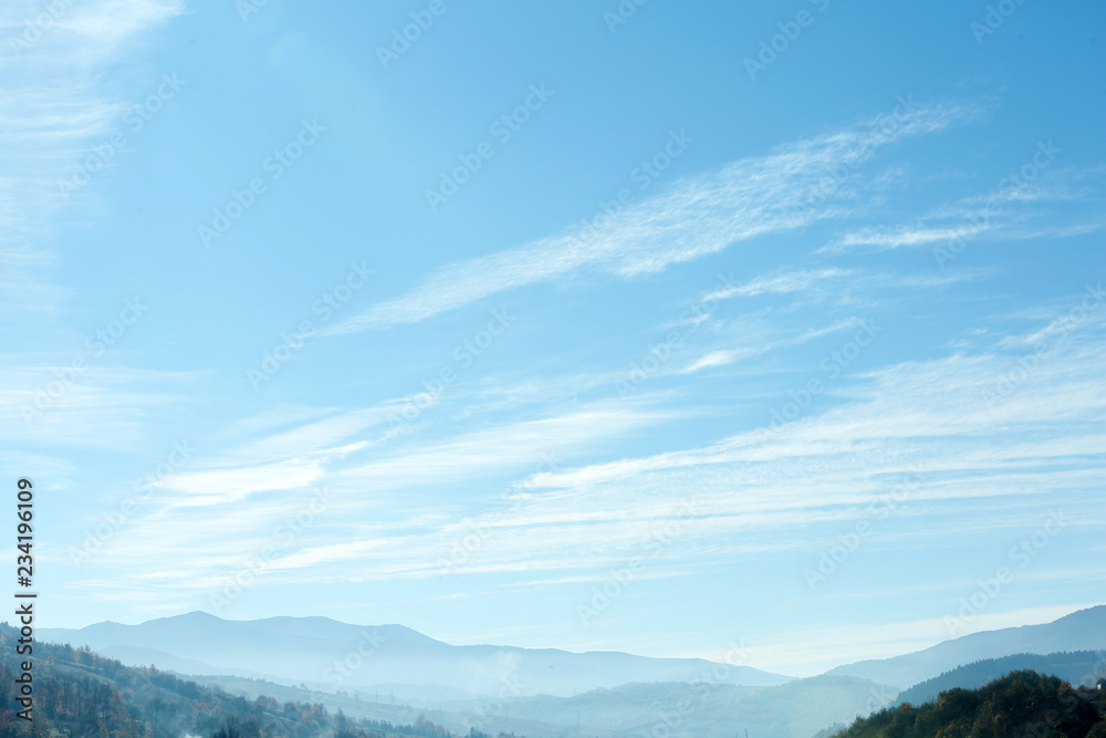 Beautiful landscape with blue sky over mountain slopes