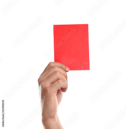 Football referee holding red card on white background, closeup
