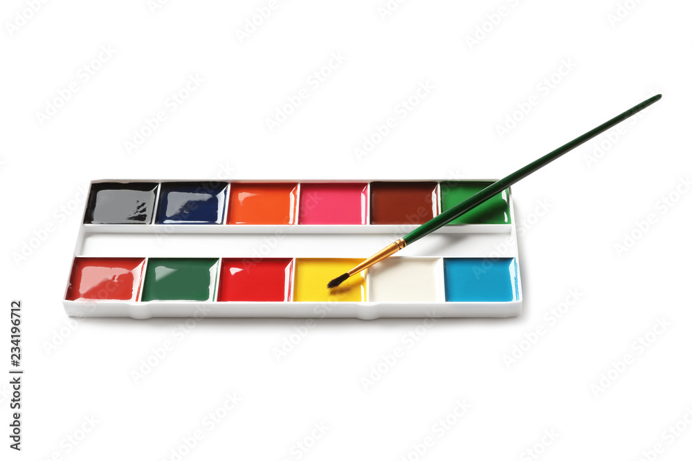 Fototapeta premium Plastic watercolor palette with brush on white background. Painting equipment for children