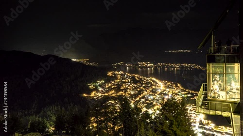 Beautiful view of Queenstown in New Zealand from the Gondola cable car station at night. Rising Moon provides nice light effects to flying clouds. Timelapse video.