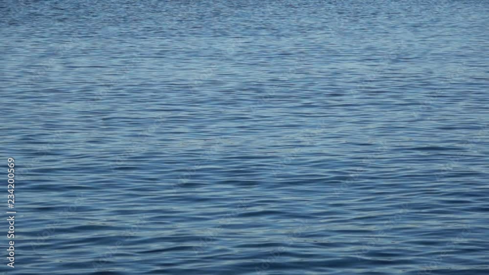 Blue waves rolling slowly into the distance Blue waves rolling slowly into the distance