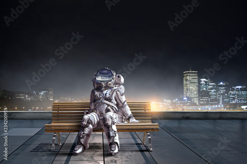 Astronaut in spacesuit on bench. Mixed media