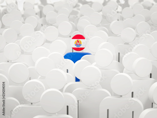 Man with flag of french polynesia in a crowd