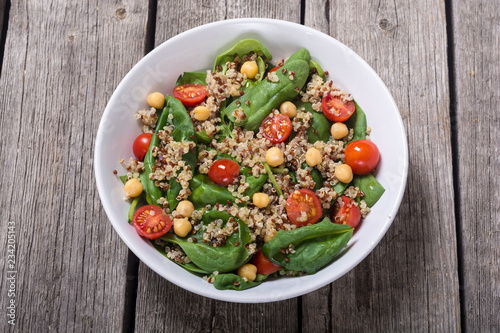 Spinach salad with quinoa , tomatoes and chickpea