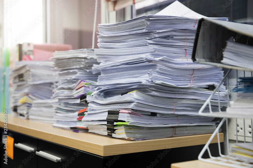 Business and finance concept of office working, Pile of unfinished documents on office desk, Stack of business paper
