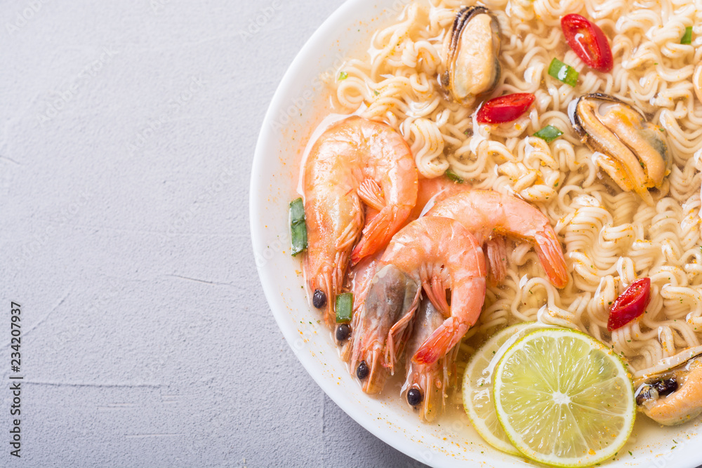 Instant noodles soup with shrimps and mssels . Asian food Instant noodles soup with shrimps and mssels . Asian food